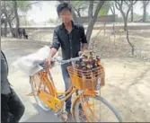  ?? HT ?? A minor boy with his bicycle loaded with liquor bottles in Bikaner.