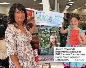  ?? BHF CYMRU ?? Anwen Rpwlands presenting a cheque to BHF Cymru’s Carmarthen Home Store manager Linda Ryan.