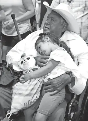  ?? PROVIDED BY JOSE ANDRADE ?? Arturo Andrade, 81, holding his granddaugh­ter, Alexia, was one of the many Hispanic victims of COVID-19 in California.