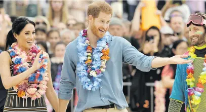  ?? Picture: AFP ?? MEET AND GREET. Prince Harry and his wife Meghan leave after a Fluro Friday session run by OneWave, a local surfing community group that raises awareness of mental health and wellbeing, at Sydney’s iconic Bondi beach yesterday. The British royals kicked off their shoes and donned tropical garlands to hit Sydney’s famed beach for the latest stop on their Australian tour.