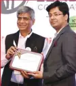  ??  ?? Kunal Singhal, MD, Easy ERP receiving the award for ‘Innovation in Supply Chain Visibility 2018’ from Pradeep Gupta, CMD, CyberMedia