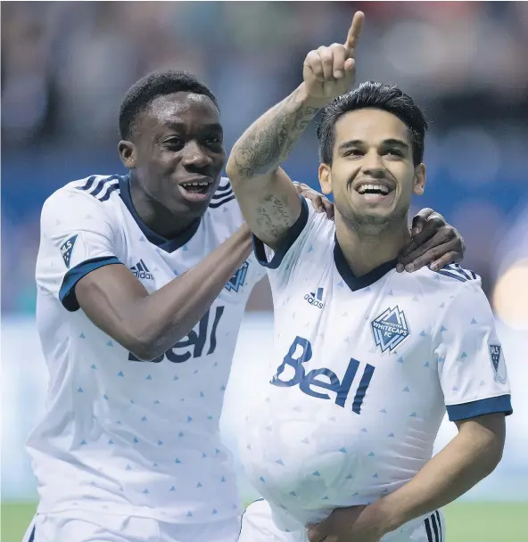  ?? — THE CANADIAN PRESS FILES ?? The Vancouver Whitecaps’ Alphonso Davies, left, and Cristian Techera celebrate Techera’s goal during first half MLS soccer action against the Los Angeles Galaxy in Vancouver on April 1. ‘I feel much better than last season,’ Techera says.