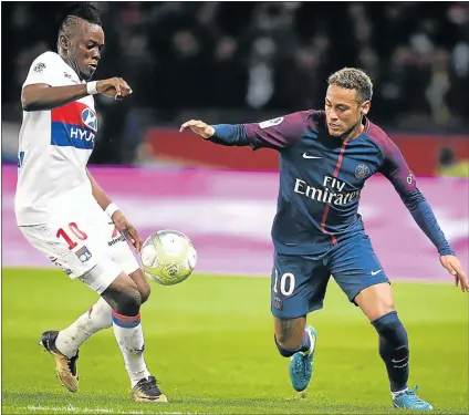  ?? Picture: GETTY IMAGES ?? KEY MAN: Lyon’s Bertrand Traore, left, fighting for the ball with PSG superstar Neymar Jr during their French Ligue 1 match at Parc des Princes in Paris. Traore is expected to lead Burkina Faso’s attack against Bafana Bafana at FNB Stadium tomorrow