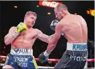  ?? ISAAC BREKKEN/AP PHOTO ?? Canelo Alvarez left, lands a punch against Sergey Kovalev during Saturday night’s fight at Las Vegas. Alvarez won the lightheavy­weight bout with an 11th-round knockout.