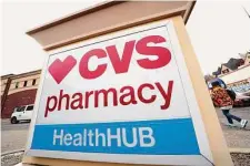  ?? Gene J. Puskar/Associated Press ?? A CVS store sign is displayed Friday in Pittsburgh. CVS Health is plunging deeper into primary care services.