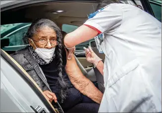  ?? STEVE SCHAEFER FOR THE AJC ?? Maude Lakes, 93, receives a COVID-19 vaccinatio­n Friday at Jackson Memorial Baptist Church. The state’s rate of vaccinatin­g seniors over age 65 is above the U.S. average.