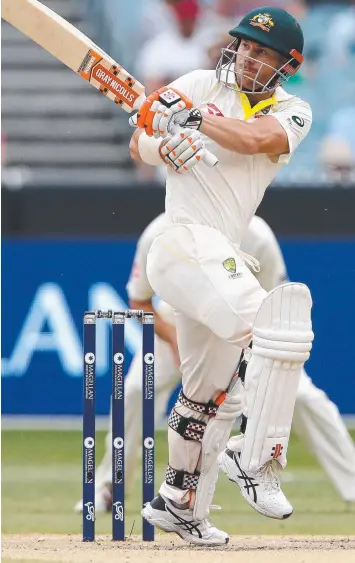  ?? Pictures: MICHAEL KLEIN and AFP ?? TOP SHOT: David Warner plays a pull-shot off Tom Curran (below).