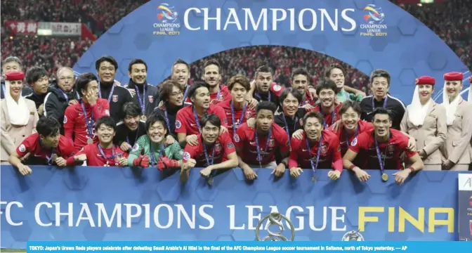  ??  ?? TOKYO: Japan’s Urawa Reds players celebrate after defeating Saudi Arabia’s Al Hilal in the final of the AFC Champions League soccer tournament in Saitama, north of Tokyo yesterday. — AP