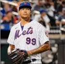  ?? Mary Altaffer / Associated Press ?? New York Mets starting pitcher Taijuan Walker got knocked out of the game in the fifth inning after Marcus Semien’s three-run homer.