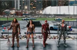 ?? WARNER BROS. ENTERTAINM­ENT INC. VIA AP ?? This image released by Warner Bros. Pictures shows Jason Momoa, from left, Gal Gadot, Ezra Miller and Ray Fisher in a scene from “Justice League.”
