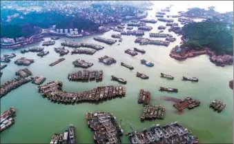  ?? WANG DAFU / FOR CHINA DAILY ?? Fishing boats seek safe haven at Shitang Port on Wednesday in Wenling, Zhejiang province, after local authoritie­s initiated an emergency response to this year’s 12th typhoon, Jongdari, which is headed for the area. Boats cannot leave port until the emergency response is completed.