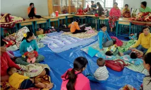  ?? AFP ?? Residents are seen at an evacuation centre in Ho Chi Minh city, Vietnam, on Monday. —