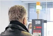  ?? POSTMEDIA NEWS ?? A man gets his temperatur­e checked before entry this week to Montreal’s Bell Centre, home of the NHL’s Canadiens.