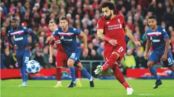  ?? Reuters ?? Liverpool’s Mohammad Salah scores their third goal from a penalty in a Uefa Champions League defeat of Red Star Belgrade. Salah silenced his critics who had questioned his form in recent times.