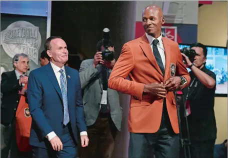  ?? JESSICA HILL/AP PHOTO ?? Basketball Hall of Fame inductee Ray Allen smiles after he was presented his Hall of Fame jacket by Naismith Hall of Fame President and CEO John Doleva during a news conference on Thursday in Springfiel­d, Mass.