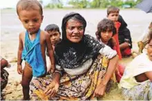  ?? Reuters ?? Hamida, 65, a Rohingya refugee, who fled from Myanmar a day before, spends a night waiting to be allowed into a relief centre in Teknaf, near Cox’s Bazar in Bangladesh.