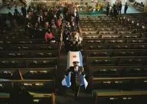  ?? CHICAGO TRIBUNE ?? The casket is carried from the church following funeral services for slain Chicago police Officer Clifton Lewis on Jan. 5, 2012.