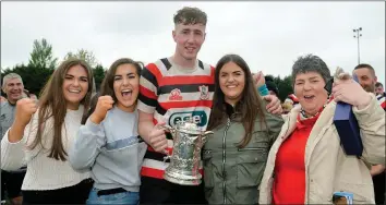  ??  ?? Nick Doyle celebratin­g with family members Sarah, Trish, Helena and Marie after kicking the winning penalty for Enniscorth­y against Wicklow in the 2019 Provincial Towns Cup final held in Navan.