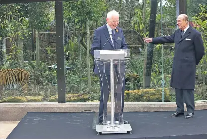  ??  ?? Look out behind you!: the Duke of Edinburgh teases Bateson, head of the Zoological Society of London, at the official opening of a new tiger enclosure at London Zoo in 2013