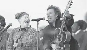  ?? MANDEL NGAN, AFP/ GETTY IMAGES ?? Pete Seeger, left, and Bruce Springstee­n perform at the We Are One Inaugural Celebratio­n at the Lincoln Memorial in 2009.