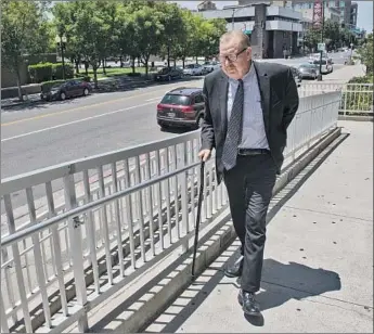  ?? Craig Sanders For The Times ?? FRANK CARSON walks toward the Modesto courthouse in 2019. The controvers­ial criminal defense lawyer had been on trial — one of the longest in state history — for the 2012 killing of a scrap metal thief.