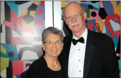  ?? (NWA Democrat-Gazette file photo/Carin Schoppmeye­r) ?? Nancy and Jim Swearingen enjoy Art of Hospice. Nancy, along with Marilyn Swearingen, shared the Bernice Young Jones Award at the fundraiser.