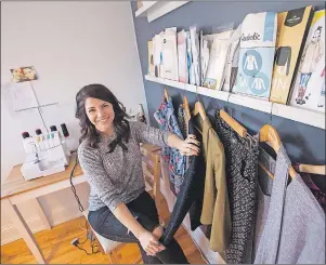  ?? CP PHOTO ?? Erica Penton is seen with some of the clothes she has recently completed at her Halifax home.