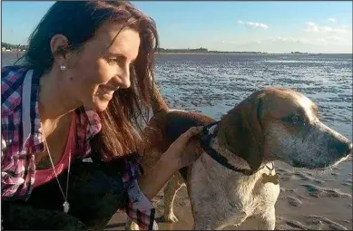  ??  ?? Beloved pet: Olivia Spionkowsk­a with Charlie the beagle, who has been missing since Saturday