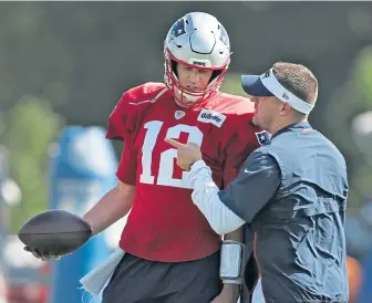  ?? STAFF PHOTO BY NANCY LANE ?? HERE’S THE WAY TO DO IT: Josh McDaniels and Tom Brady aren’t taking the Bills defense lightly.