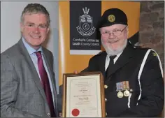  ??  ?? Tony Duffy, Louth Civil Defence receives his award from Cllr. Mark Dearey, Chairman Muncipal District of Dundalk at the inaugural Civic Awards Presentati­on Ceremony held in the County Museum.