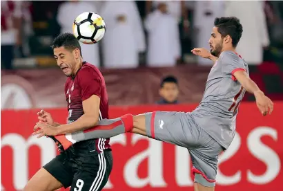  ?? Photo by Ryan Lim ?? Al Wahda’s Mourad Batna vies for the ball against Al Duhail’s Sultan Hussain Al Brake (right) during their AFC Champions League match at the Zayed Sports City in Abu Dhabi. —