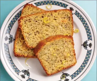  ?? DEB LINDSEY, FOR THE WASHINGTON POST ?? This brightly lemony quick bread, punctuated with gently crunchy poppy seeds, is sweet and tender enough to satisfy a cake craving, but it does so in a much better-for-you way.