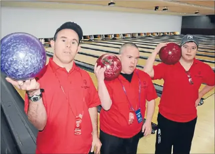  ??  ?? Bowling buddies: Mana Special Olympics club tenpin bowlers Kirk McCarthy, Dane Muir and Travis Wilson competed against dozens of North Island counterpar­ts when they hosted a bowling tournament last month. The club wants to expand into swimming and...