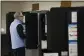  ?? MIGUEL MARTINEZ/MIGUEL. MARTINEZJI­MENEZ@AJC.COM ?? Decatur resident Tom Barry casts his ballot last month during the Georgia presidenti­al primaries.