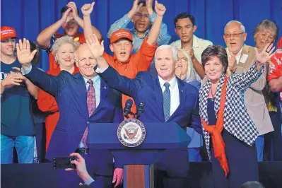  ?? JIM THOMPSON/JOURNAL ?? Vice President Mike Pence is flanked by Republican candidates Steve Pearce and Yvette Herrell during a rally Friday at Roswell Internatio­nal Air Center. Pearce is the GOP nominee for governor, and Herrell is running for Pearce’s seat in New Mexico’s 2nd Congressio­nal District.