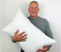  ??  ?? Alexander Miles, inventor of the Gx Pillow pictured with his invention