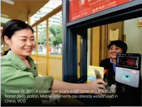  ??  ?? October 12, 2017: A passenger scans a QR code at a Bus Rapid pid Transit (BRT) station. Mobile payments are already widely useded in China. VCG