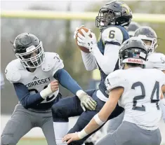  ?? MICHAEL CORRADO / BOSTON HERALD ?? GOOD HANDS: St. Mary’s Eni Falayi makes a catch while surrounded by Cohasset defenders Sam Orway and Danny Nolan.