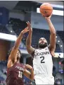  ?? Jessica Hill / Associated Press ?? UConn’s R.J. Cole (2) shoots past Maryland-Eastern Shore’s Kohen Thompson (11) on Tuesday in Hartford.