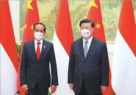  ?? FENG YONGBIN / CHINA DAILY ?? President Xi Jinping meets with Indonesian President Joko Widodo at the Diaoyutai State Guesthouse in Beijing on Tuesday.