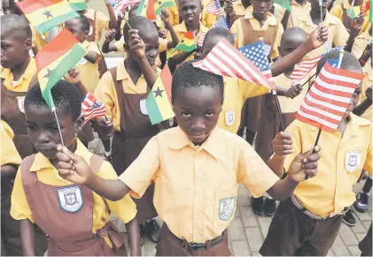  ?? Picture: Reuters ?? Primary school children carry flags as they greet US First Lady Melania Trump on arrival in the Ghanaian capital Accra yesterday.