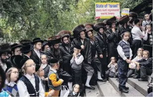  ?? PHOTO: REUTERS ?? Not our country . . . Jewish Americans protest against the State of Israel outside the UN headquarte­rs in New York as Israeli Prime Minister Benjamin Netanyahu attends the General Assembly yesterday.