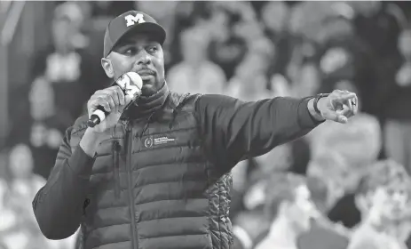  ?? RICK OSENTOSKI/USA TODAY SPORTS ?? Michigan Wolverines head football coach Sherrone Moore addresses the basketball crowd during a timeout against the Iowa Hawkeyes at Crisler Center in Ann Arbor on Jan. 27.