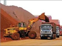  ?? ZHANG LEI / FOR CHINA DAILY ?? Iron ore is unloaded at Rizhao Port, Shandong province.