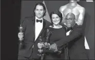  ?? AP/ JORDAN STRAUSS ?? Jeremy Kleiner ( from left), Adele Romanski and Barry Jenkins, winners of the Academy Award for best picture for Moonlight, pose Sunday at the Dolby Theatre in Los Angeles.