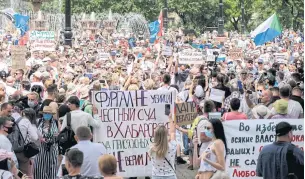 ??  ?? WANT PUTIN TO RESIGN: People hold banners and signs during an unauthoris­ed rally yesterday in support of Sergei Furgal who was arrested in Khabarovsk earlier this month.