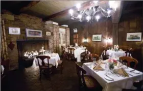  ?? PHOTO COURTESY OF VICKERS ?? At Vickers Restaurant, a large brick fireplace dominates the Hunt Room.