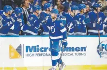  ?? Chris O’meara, The Associated Press ?? Tampa Bay center Steven Stamkos celebrates with the bench after scoring against the Avs.