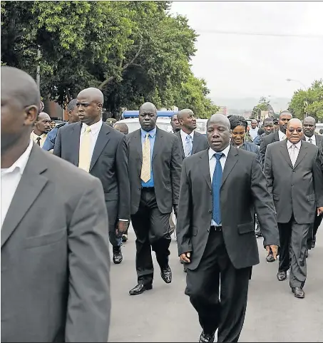  ??  ?? JUSTICE OBSTRUCTED: The image of President Jacob Zuma surrounded by bodyguards and leaving a courtroom even before he took office has come to define the Zuma years