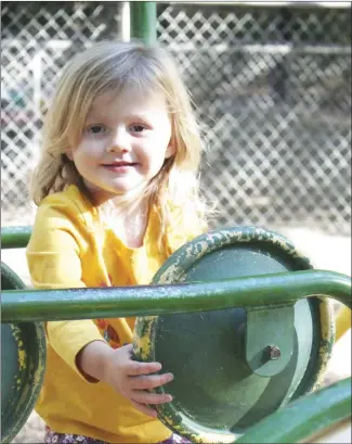  ?? Brodie Johnson • Times-Herald ?? Cooler mornings over the last few weeks have allowed for children in the area to enjoy the nice temperatur­es and take advantage of being outside. Alison McLean, 3, plays on a peice of playground equipment at a local daycare center.